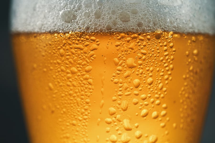A close-up view of a glass of cold beer. 
