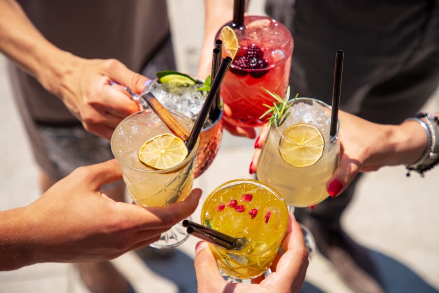 Five vodka cocktails raised in a celebratory toast