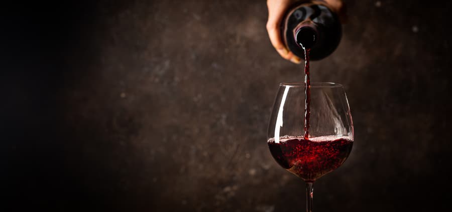 Red wine being poured into a glass