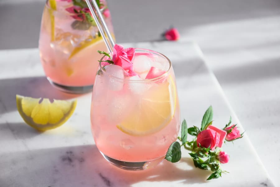 Beautiful pink mocktails with lemon wedge and non-alcoholic spirits