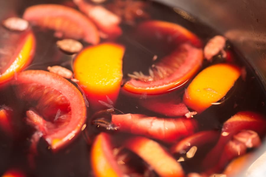 Close-up of bowl prepared with red wine and fruits for mulling